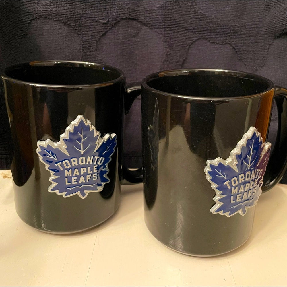 Toronto Maple Leafs - NHL ceramic mugs with stainless emblem.  Two mugs